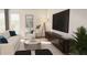 Cozy living room area with comfortable seating, modern entertainment setup, and natural light at 600 3Rd S Ave # 405, St Petersburg, FL 33701