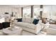 Open concept living room features a comfy sofa and flows into the kitchen at 600 3Rd S Ave # 405, St Petersburg, FL 33701