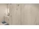 Clean shower with marble-look tile and glass enclosure at 600 3Rd S Ave # 405, St Petersburg, FL 33701
