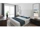 Cozy bedroom with soft lighting, a comfortable bed, neutral colors, and stylish accents at 600 3Rd S Ave # 506, St Petersburg, FL 33701