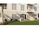 Apartment building with green lawns, patios with seating, palm trees, and large windows at 600 3Rd S Ave # 506, St Petersburg, FL 33701