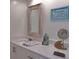 Vanity with quartz countertop and beach themed decor at 6372 Palma Del Mar S Blvd # 705, St Petersburg, FL 33715