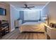 Bright bedroom with a ceiling fan and large window at 6372 Palma Del Mar S Blvd # 705, St Petersburg, FL 33715