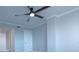 Bedroom with ceiling fan and white door at 6372 Palma Del Mar S Blvd # 705, St Petersburg, FL 33715