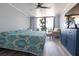 Comfortable bedroom with a queen-size bed and balcony access at 6372 Palma Del Mar S Blvd # 705, St Petersburg, FL 33715