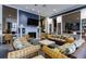 Common area with wicker furniture and fireplace at 6372 Palma Del Mar S Blvd # 705, St Petersburg, FL 33715