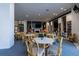 Community room with tables, chairs, and a library at 6372 Palma Del Mar S Blvd # 705, St Petersburg, FL 33715