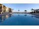 Refreshing community pool with lounge chairs and waterfront views at 6372 Palma Del Mar S Blvd # 705, St Petersburg, FL 33715