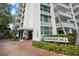 The Harbor Hill building entrance features a brick walkway and well-maintained landscaping at 700 Beach Ne Dr # 805, St Petersburg, FL 33701