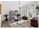 Bright office space with a large rug, featuring natural light from dual windows and shelving at 805 Islebay Dr, Apollo Beach, FL 33572
