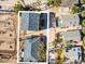 Aerial view of two houses with gray roofs and a parking area at 820 Gulf Blvd # S 1-3, Indian Rocks Beach, FL 33785