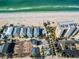 Aerial view of beach, new homes, and high rise at 820 Gulf Blvd # S 1-3, Indian Rocks Beach, FL 33785