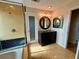 Bathroom with granite vanity and a large mirror at 820 Gulf Blvd # S 1-3, Indian Rocks Beach, FL 33785