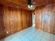 Bedroom with wood paneling and tile floors at 820 Gulf Blvd # S 1-3, Indian Rocks Beach, FL 33785