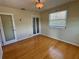 Well lit bedroom with hardwood floors and closet at 820 Gulf Blvd # S 1-3, Indian Rocks Beach, FL 33785