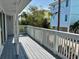 Spacious deck with white railings and views of surrounding homes at 820 Gulf Blvd # S 1-3, Indian Rocks Beach, FL 33785