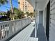 Private deck overlooking neighborhood with white railings at 820 Gulf Blvd # S 1-3, Indian Rocks Beach, FL 33785