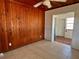 Dining room with wood paneled walls and tile floors at 820 Gulf Blvd # S 1-3, Indian Rocks Beach, FL 33785