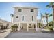 Two-story house with gray siding, elevated foundation, and parking at 820 Gulf Blvd # S 1-3, Indian Rocks Beach, FL 33785