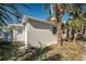 Light gray house exterior with palm trees and a small yard at 820 Gulf Blvd # S 1-3, Indian Rocks Beach, FL 33785