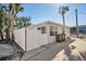 Light gray house exterior with a white fence and driveway at 820 Gulf Blvd # S 1-3, Indian Rocks Beach, FL 33785