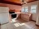 Pink kitchen with appliances and tile floors at 820 Gulf Blvd # S 1-3, Indian Rocks Beach, FL 33785