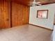 Living room with wood paneling and tile floors at 820 Gulf Blvd # S 1-3, Indian Rocks Beach, FL 33785