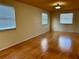 Spacious living room with hardwood floors and neutral walls at 820 Gulf Blvd # S 1-3, Indian Rocks Beach, FL 33785