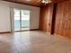 Living room with wood paneling and tile floors at 820 Gulf Blvd # S 1-3, Indian Rocks Beach, FL 33785