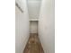 Small hall closet with carpeted floor and coat hooks at 8715 Morrison Oaks Ct, Temple Terrace, FL 33637