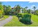 Exterior of the building with lush landscaping and a walkway at 10263 Gandy N Blvd # 107, St Petersburg, FL 33702