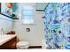 Charming bathroom with white subway tile, a shower/tub, and nautical decor at 115 Athens St, Tarpon Springs, FL 34689