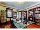 Bright dining room with hardwood floors, glass table, and French doors at 115 Athens St, Tarpon Springs, FL 34689