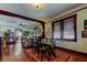 Bright dining area with hardwood floors and view into living room at 115 Athens St, Tarpon Springs, FL 34689