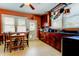 Well-equipped kitchen featuring dark wood cabinets and granite counters at 115 Athens St, Tarpon Springs, FL 34689