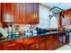 Modern kitchen with dark wood cabinets and granite countertops at 115 Athens St, Tarpon Springs, FL 34689