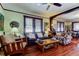 Bright living room with hardwood floors, comfortable seating, and a large window at 115 Athens St, Tarpon Springs, FL 34689