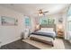 Bright bedroom with a king-size bed and beach-themed art at 1310 E 19Th Ave # A, Tampa, FL 33605