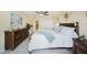 Spacious bedroom with king-size bed and wood furniture at 1400 Gulf Blvd # 406, Clearwater Beach, FL 33767