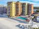 Aerial view of condo building, pool, and beach at 18610 Gulf Blvd # 108, Indian Shores, FL 33785