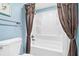 Clean bathroom with a shower/tub combo and white fixtures at 18610 Gulf Blvd # 108, Indian Shores, FL 33785