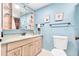 Charming bathroom with light blue walls and updated vanity at 18610 Gulf Blvd # 108, Indian Shores, FL 33785