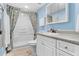 Clean bathroom with a walk-in shower and modern vanity at 18610 Gulf Blvd # 108, Indian Shores, FL 33785