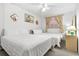 Bedroom with two twin beds and a ceiling fan at 18610 Gulf Blvd # 108, Indian Shores, FL 33785