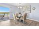 Bright dining area with water views and elegant chairs at 18610 Gulf Blvd # 108, Indian Shores, FL 33785
