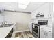 Bright kitchen features stainless steel appliances and light wood cabinets at 18610 Gulf Blvd # 108, Indian Shores, FL 33785