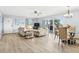 Open living and dining area with water views at 18610 Gulf Blvd # 108, Indian Shores, FL 33785