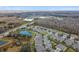 Aerial view of a community with houses, roads, and natural landscape at 19315 Hawk Valley Dr, Tampa, FL 33647