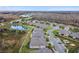 Community of houses near a pond and road; expansive view at 19315 Hawk Valley Dr, Tampa, FL 33647