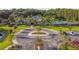 Aerial view of community clubhouse and parking lot with landscaping at 19315 Hawk Valley Dr, Tampa, FL 33647